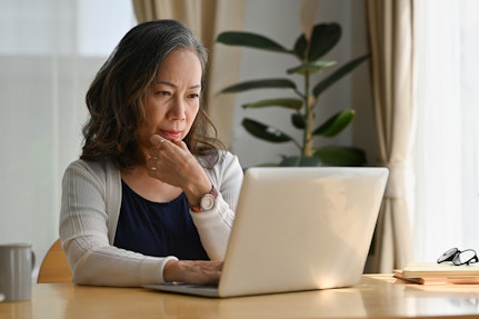 Woman at laptop for website